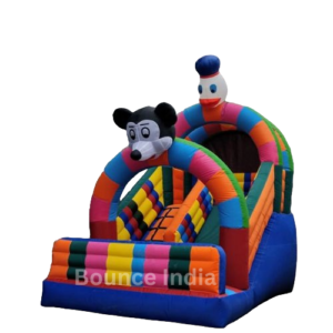 Children playing on a Mickey Mouse themed bouncy castle